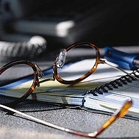 Graphic Image - Reading Glasses on Desk Schedule